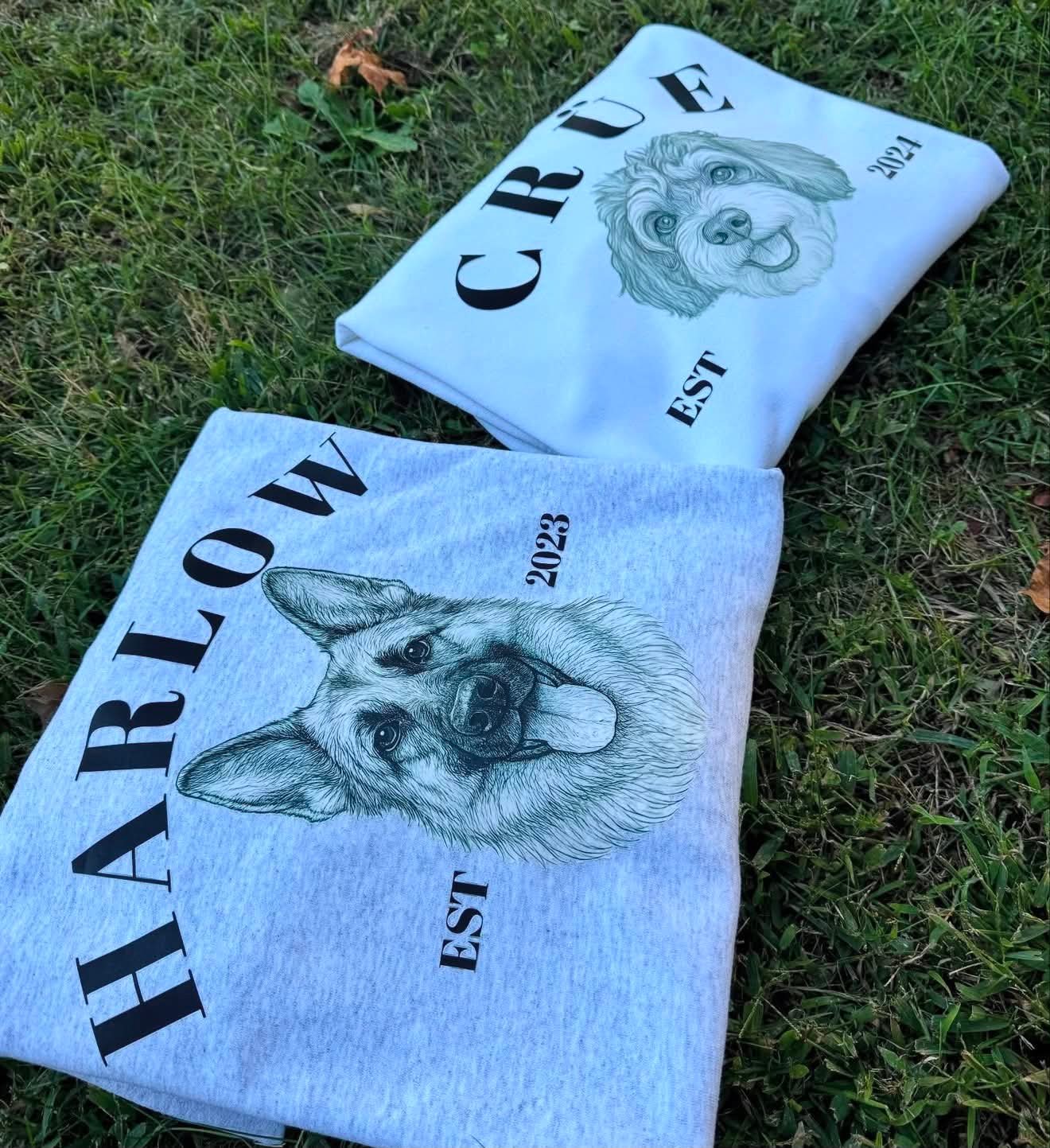 Two pet portrait sweatshirts printed with dog illustrations reading Harlow Est 2023 and Crue Est 2024